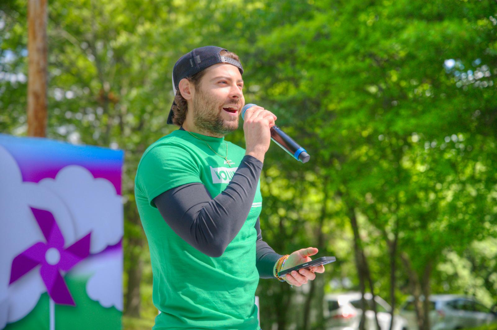 Tyler Sullivan, clinical exercise specialist, speaking at the Walk to Cure Arthritis in Boston
